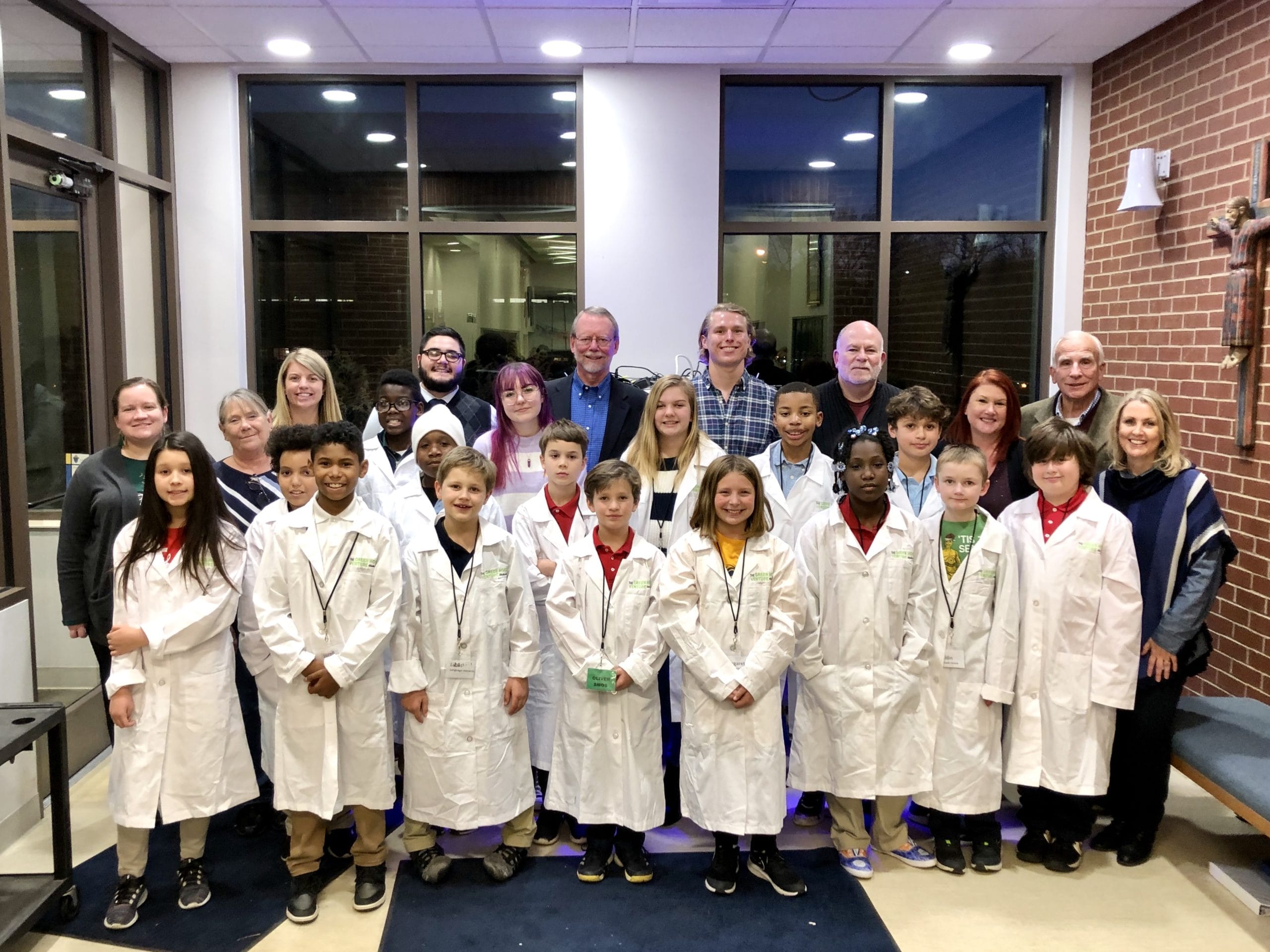 Group Picture of GHV staff and students wearing lab coats